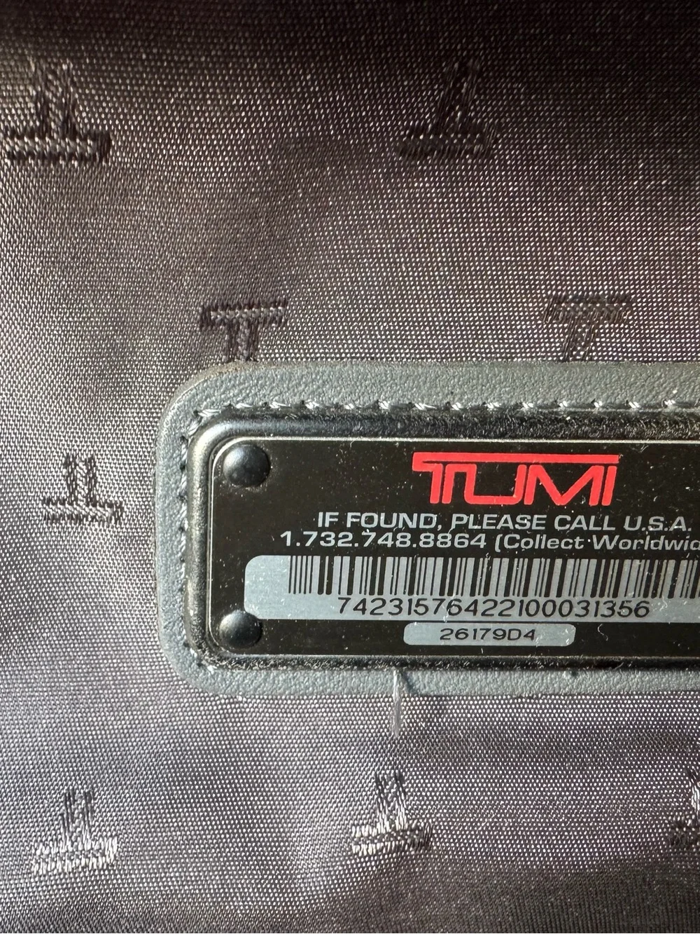 Tumi Black Nylon Travel Backpack with Multiple Compartments